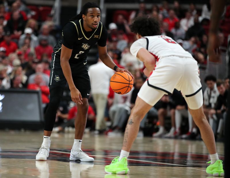 Feb 10, 2024; Lubbock, Texas, USA;  Central Florida Knights guard Shemarri Allen (2) looks for an opening against Texas Tech Red Raiders guard Pop Isaacs (2) in the second half at United Supermarkets Arena. Mandatory Credit: Michael C. Johnson-USA TODAY Sports