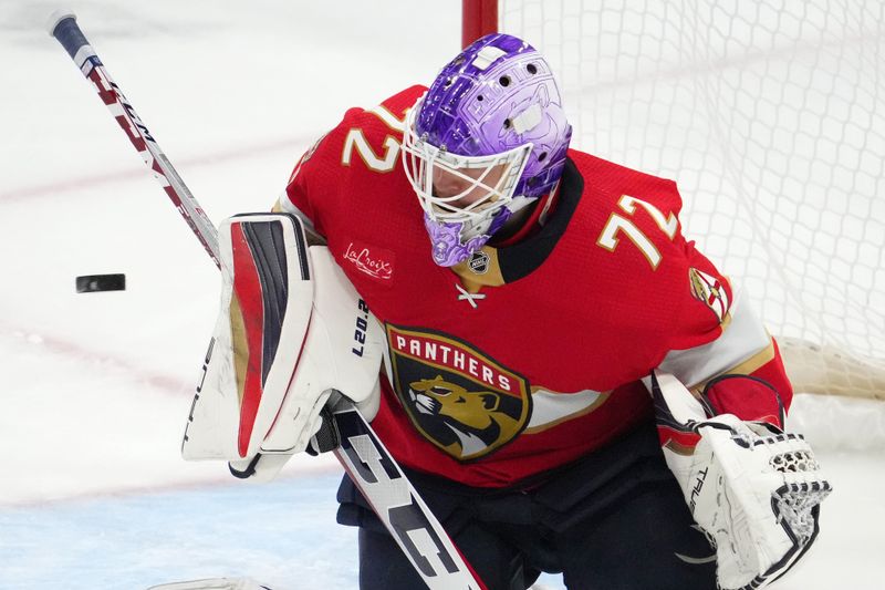 Nov 10, 2023; Sunrise, Florida, USA; Florida Panthers goaltender Sergei Bobrovsky (72) blocks a shot against the Carolina Hurricanes during the third period at Amerant Bank Arena. Mandatory Credit: Jasen Vinlove-USA TODAY Sports