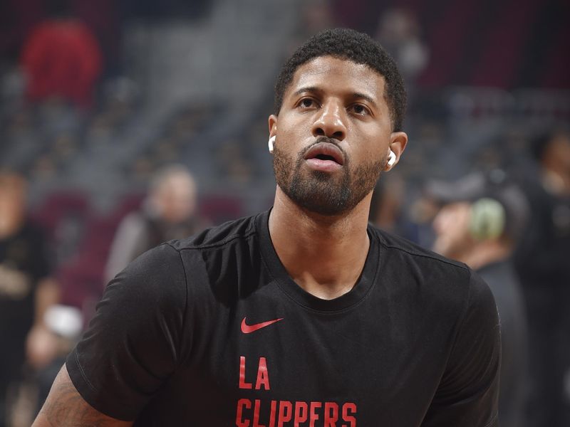 CLEVELAND, OH - JANUARY 29: Paul George #13 of the LA Clippers warms up before the game against the Cleveland Cavaliers on January 29, 2024 at Rocket Mortgage FieldHouse in Cleveland, Ohio. NOTE TO USER: User expressly acknowledges and agrees that, by downloading and/or using this Photograph, user is consenting to the terms and conditions of the Getty Images License Agreement. Mandatory Copyright Notice: Copyright 2024 NBAE (Photo by David Liam Kyle/NBAE via Getty Images)