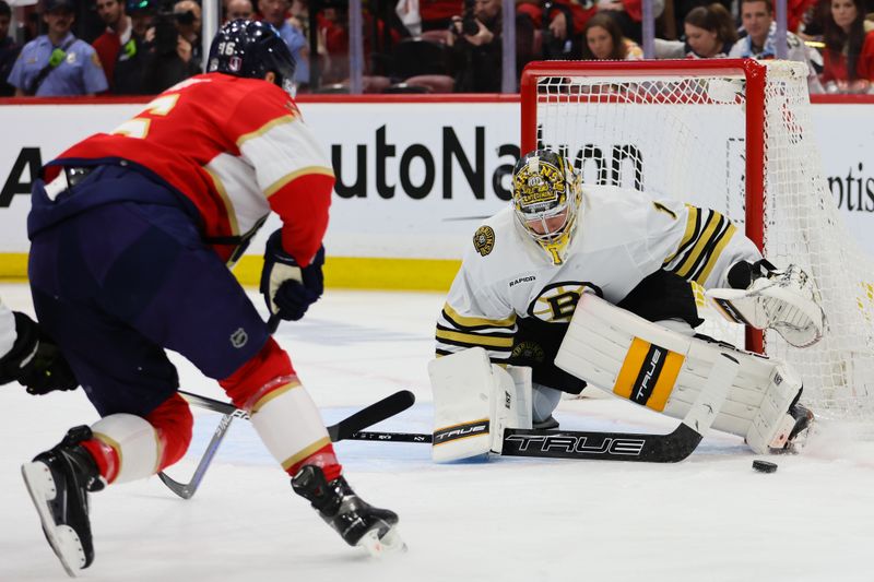 May 8, 2024; Sunrise, Florida, USA; Boston Bruins goaltender Jeremy Swayman (1) makes a save against Florida Panthers center Aleksander Barkov (16) during the first period in game two of the second round of the 2024 Stanley Cup Playoffs at Amerant Bank Arena. Mandatory Credit: Sam Navarro-USA TODAY Sports