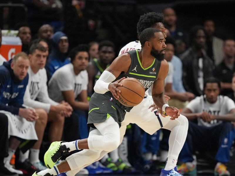 MINNEAPOLIS, MN - NOVEMBER 1: Mike Conley #10 of the Minnesota Timberwolves dribbles the ball during the game against the Denver Nuggets on November 1, 2024 at Target Center in Minneapolis, Minnesota. NOTE TO USER: User expressly acknowledges and agrees that, by downloading and or using this Photograph, user is consenting to the terms and conditions of the Getty Images License Agreement. Mandatory Copyright Notice: Copyright 2024 NBAE (Photo by Jordan Johnson/NBAE via Getty Images)