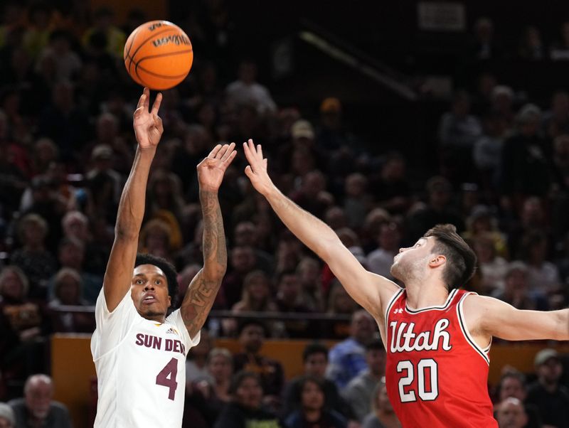 Feb 18, 2023; Tempe, Arizona, USA; Arizona State Sun Devils guard Desmond Cambridge Jr. (4) shoots over Utah Utes guard Lazar Stefanovic (20) during the second half at Desert Financial Arena. Mandatory Credit: Joe Camporeale-USA TODAY Sports