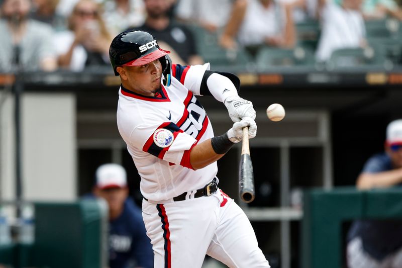 Aug 13, 2023; Chicago, Illinois, USA; Chicago White Sox catcher Carlos Perez (36) singles against the Milwaukee Brewers during the seventh inning at Guaranteed Rate Field. Mandatory Credit: Kamil Krzaczynski-USA TODAY Sports