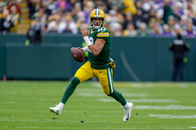 Green Bay Packers quarterback Jordan Love (10) rushes during an NFL football game between the Green Bay Packers and Minnesota Vikings Sunday, Oct. 29, 2023, in Green Bay, Wis. (AP Photo/Matt Ludtke)