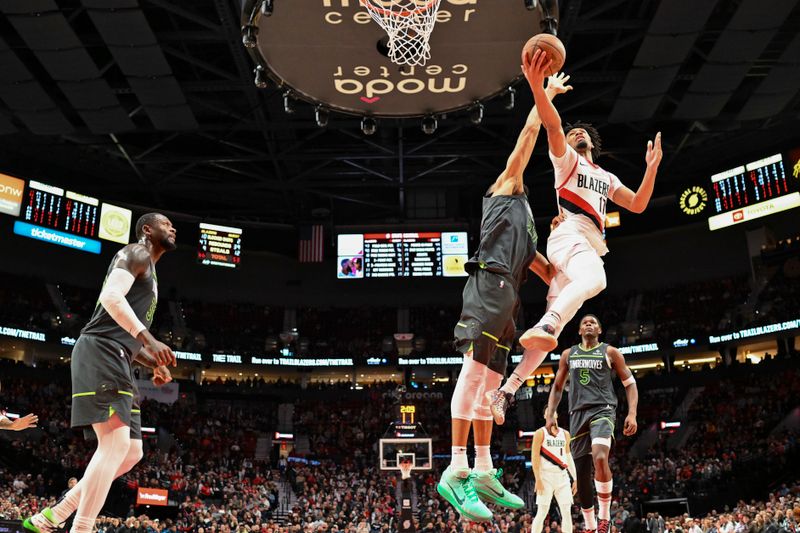 PORTLAND, OREGON - NOVEMBER 13: Shaedon Sharpe #17 of the Portland Trail Blazers drives to the basket against Rudy Gobert #27 of the Minnesota Timberwolves during the fourth quarter of the game at Moda Center on November 13, 2024 in Portland, Oregon. The Portland Trail Blazers won 106-98. NOTE TO USER: User expressly acknowledges and agrees that, by downloading and or using this photograph, User is consenting to the terms and conditions of the Getty Images License Agreement. (Photo by Alika Jenner/Getty Images)