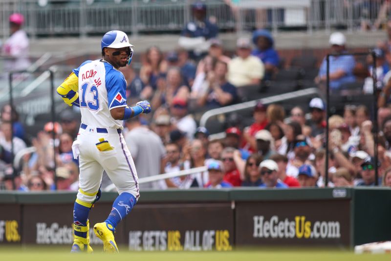 May 31, 2025; Atlanta, Georgia, USA; Atlanta Braves right fielder Ronald Acuna Jr. (13) reacts after a single against the Boston Red Sox in the first inning at Truist Park. Mandatory Credit: Brett Davis-Imagn Images