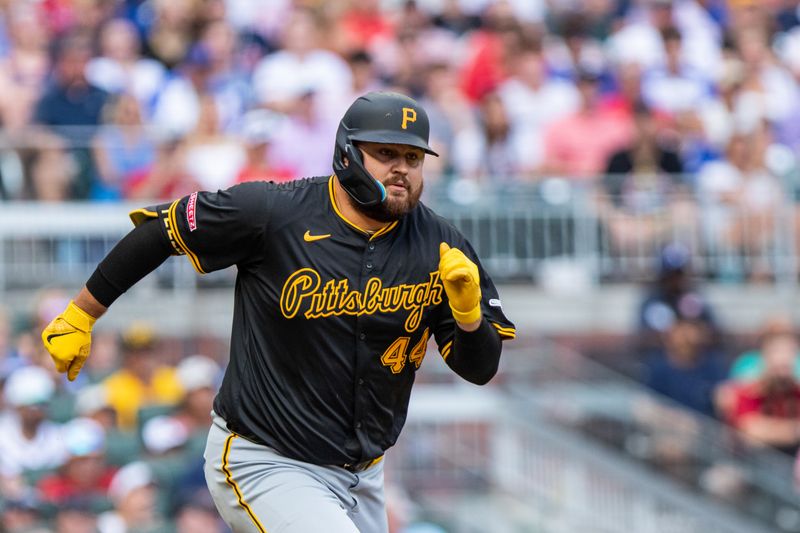 Jun 29, 2024; Cumberland, Georgia, USA; Pittsburgh Pirates first base Rowdy Tellez (44) runs to first base after hitting against Atlanta Braves during the eighth inning at Truist Park. Mandatory Credit: Jordan Godfree-USA TODAY Sports