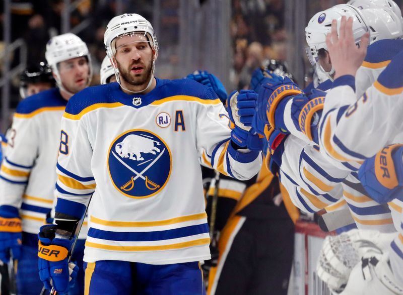 Jan 6, 2024; Pittsburgh, Pennsylvania, USA;  Buffalo Sabres left wing Zemgus Girgensons (28) celebrates with the Sabres bench after scoring a goal against the Pittsburgh Penguins during the third period at PPG Paints Arena. Buffalo won 3-1. Mandatory Credit: Charles LeClaire-USA TODAY Sports