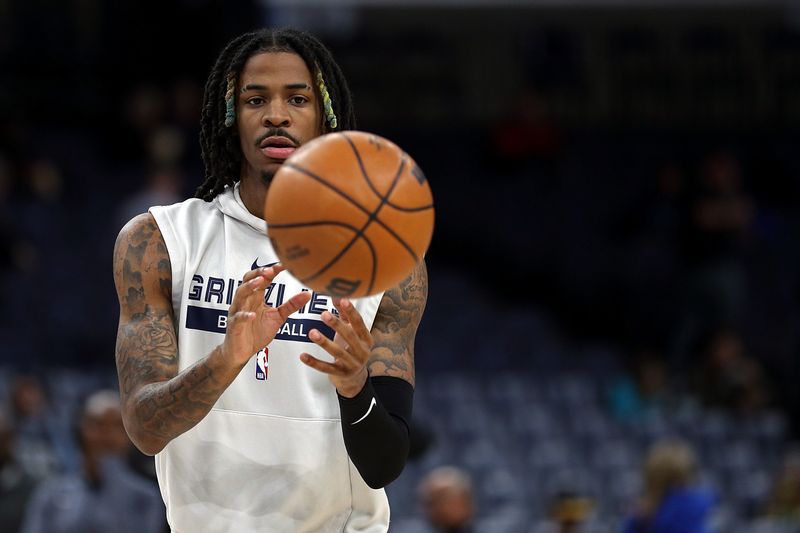 MEMPHIS, TENNESSEE - NOVEMBER 18: Ja Morant #12 of the Memphis Grizzlies warms up before the game against the Oklahoma City Thunder at FedExForum on November 18, 2022 in Memphis, Tennessee. NOTE TO USER: User expressly acknowledges and agrees that, by downloading and or using this photograph, User is consenting to the terms and conditions of the Getty Images License Agreement. (Photo by Justin Ford/Getty Images)