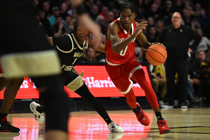 Jan 28, 2023; Winston-Salem, North Carolina, USA;   North Carolina State Wolfpack guard Terquavion Smith (0) drives on Wake Forest Demon Deacons guard Tyree Appleby (1) during the second half at Lawrence Joel Veterans Memorial Coliseum. Mandatory Credit: William Howard-USA TODAY Sports