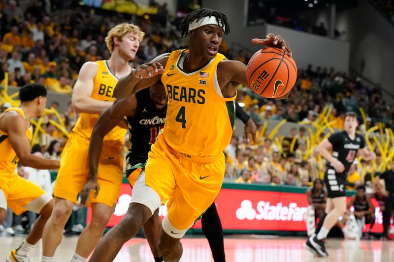 Jan 13, 2024; Waco, Texas, USA; Baylor Bears guard Ja'Kobe Walter (4) grabs the rebound against the Cincinnati Bearcats during the first half at Paul and Alejandra Foster Pavilion. Mandatory Credit: Raymond Carlin III-USA TODAY Sports