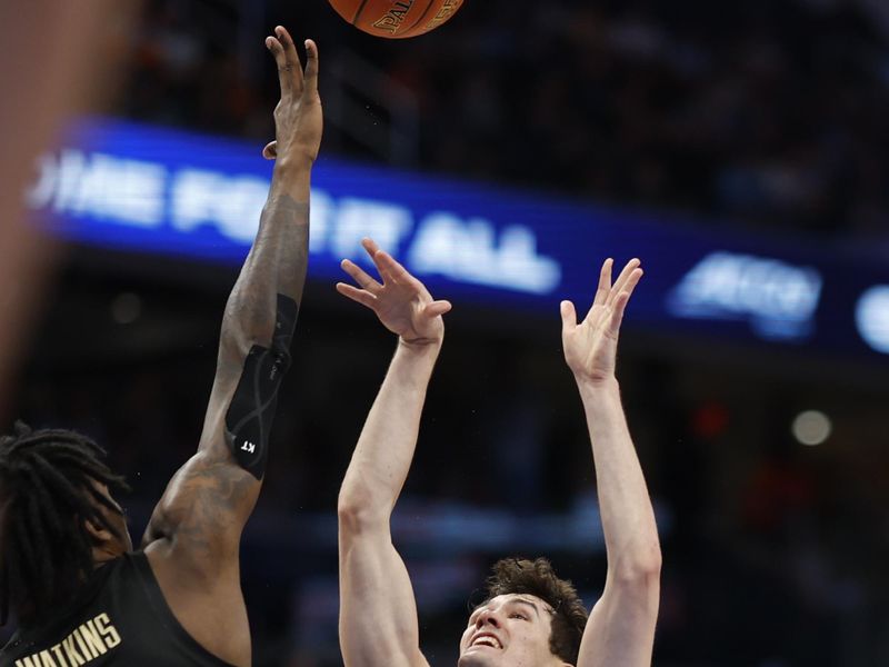 Mar 14, 2024; Washington, D.C., USA; North Carolina guard Cormac Ryan (3) shoots the ball as Florida State forward Jamir Watkins (2) defends in the second half at Capital One Arena. Mandatory Credit: Geoff Burke-USA TODAY Sports