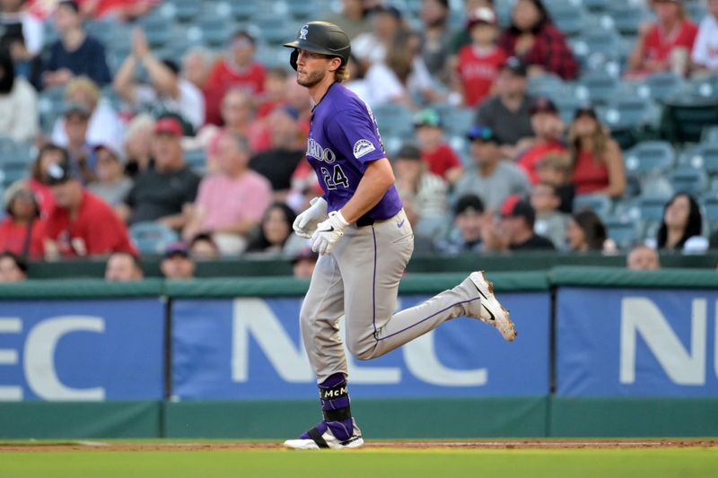 Jul 30, 2024; Anaheim, California, USA;  Colorado Rockies third baseman Ryan McMahon (24) rounds the bases after hitting a 3-run home run in the second inning at Angel Stadium. Mandatory Credit: Jayne Kamin-Oncea-USA TODAY Sports