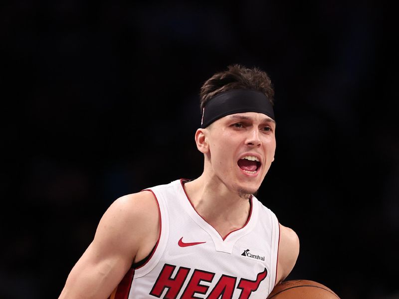 NEW YORK, NEW YORK - JANUARY 15:  Tyler Herro #14 of the Miami Heat celebrates a 95-94 overtime win against the Brooklyn Nets during their game at Barclays Center on January 15, 2024 in New York City.   User expressly acknowledges and agrees that, by downloading and or using this photograph, User is consenting to the terms and conditions of the Getty Images License Agreement.  (Photo by Al Bello/Getty Images)