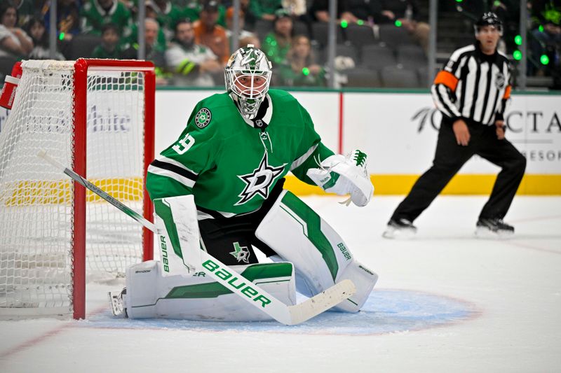 Oct 12, 2024; Dallas, Texas, USA; Dallas Stars goaltender Jake Oettinger (29) faces the New York Islanders attack during the first period at the American Airlines Center. Mandatory Credit: Jerome Miron-Imagn Images