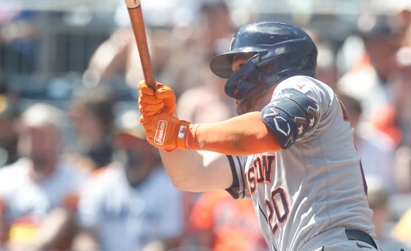 Apr 12, 2023; Pittsburgh, Pennsylvania, USA;  Houston Astros center fielder Chas McCormick (20) hits a single against the Pittsburgh Pirates during the third inning at PNC Park. Mandatory Credit: Charles LeClaire-USA TODAY Sports