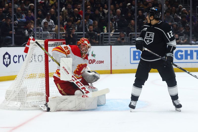 Dec 23, 2023; Los Angeles, California, USA; Calgary Flames goaltender Jacob Markstrom (25) makes a save during the second period against the Los Angeles Kings at Crypto.com Arena. Mandatory Credit: Jessica Alcheh-USA TODAY Sports