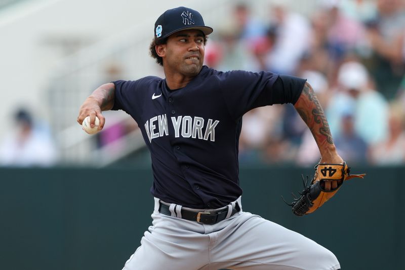 Mar 13, 2023; Fort Myers, Florida, USA;  New York Yankees starting pitcher Deivi Garcia (83) throws a pitch against the Minnesota Twins in the fourth inning during spring training at Hammond Stadium. Mandatory Credit: Nathan Ray Seebeck-USA TODAY Sports