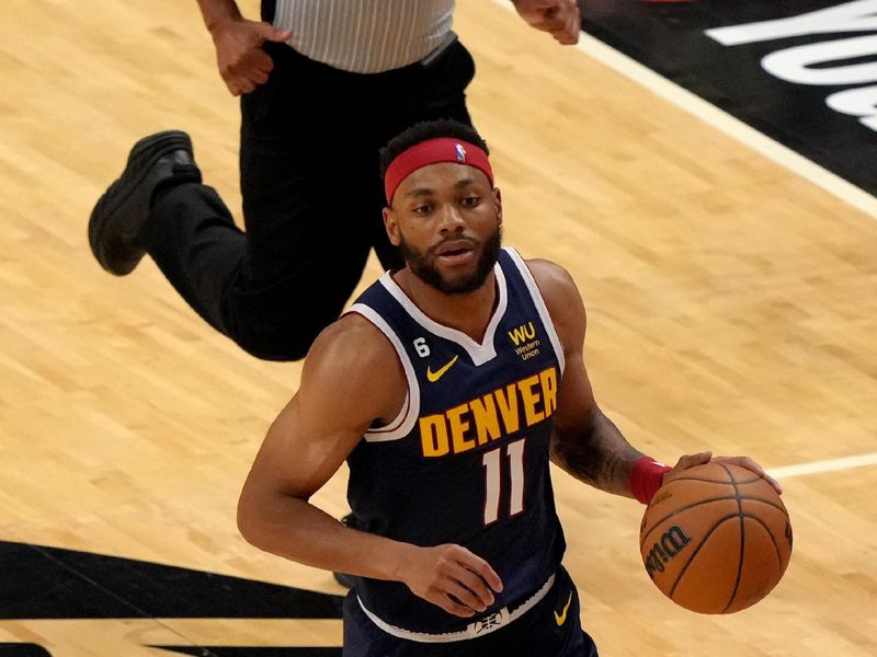 MIAMI, FL - JUNE 9: Bruce Brown #11 of the Denver Nuggets handles the ball during the game against the Miami Heat during Game Four of the 2023 NBA Finals on June 9, 2023 at Kaseya Center in Miami, Florida. NOTE TO USER: User expressly acknowledges and agrees that, by downloading and or using this Photograph, user is consenting to the terms and conditions of the Getty Images License Agreement. Mandatory Copyright Notice: Copyright 2023 NBAE (Photo by Eric Espada/NBAE via Getty Images)