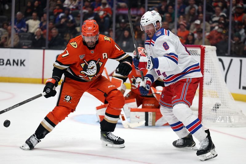 Jan 19, 2026; Anaheim, California, USA;  Anaheim Ducks left wing Alex Killorn (17) and New York Rangers center J.T. Miller (8) battle for the puck during the first period at Honda Center. Mandatory Credit: Kiyoshi Mio-Imagn Images