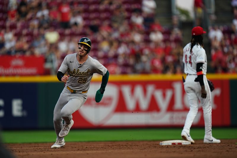 Aug 29, 2024; Cincinnati, Ohio, USA;  Oakland Athletics designated hitter Brent Rooker (25) runs to third base during the ninth inning of the MLB game between the Cincinnati Reds and Oakland Athletics, Thursday, Aug. 29, 2024, at Cintas Center in Cincinnati. The Reds won 10-9. Mandatory Credit: Frank Bowen IV/The Cincinnati Enquirer-USA TODAY Sports