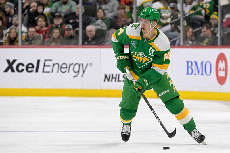 Feb 17, 2024; Saint Paul, Minnesota, USA;  Minnesota Wild forward Joel Eriksson Ek (14) skates with the puck against the Buffalo Sabres during the second period at Xcel Energy Center. Mandatory Credit: Nick Wosika-USA TODAY Sports