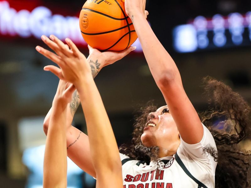 Jan 28, 2024; Columbia, South Carolina, USA; South Carolina Gamecocks center Kamilla Cardoso (10) shoots over Vanderbilt Commodores forward Khamil Pierre (12) in the first half at Colonial Life Arena. Mandatory Credit: Jeff Blake-USA TODAY Sports