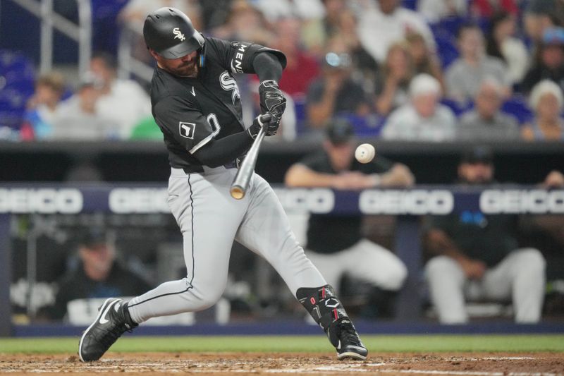 Jul 7, 2024; Miami, Florida, USA;  Chicago White Sox third baseman Danny Mendick (0) hits a two-run home run in the fourth inning against the Miami Marlins at loanDepot Park. Mandatory Credit: Jim Rassol-USA TODAY Sports