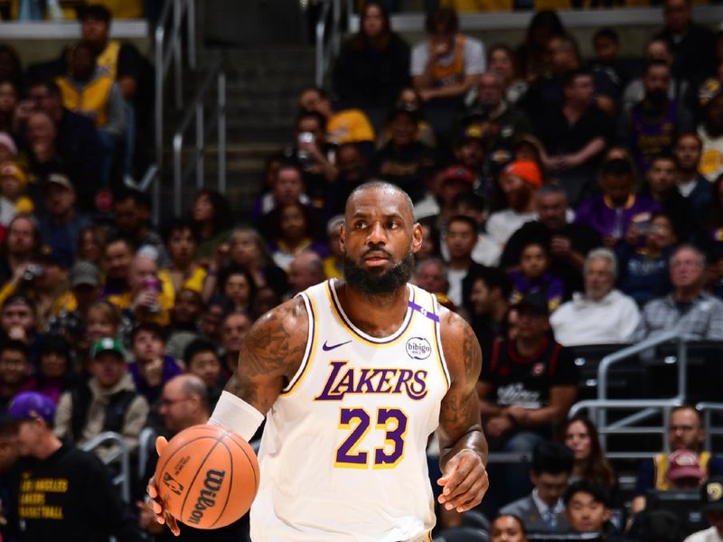 LOS ANGELES, CA - NOVEMBER 23: LeBron James #23 of the Los Angeles Lakers dribbles the ball during the game against the Denver Nuggets on November 23, 2024 at Crypto.Com Arena in Los Angeles, California. NOTE TO USER: User expressly acknowledges and agrees that, by downloading and/or using this Photograph, user is consenting to the terms and conditions of the Getty Images License Agreement. Mandatory Copyright Notice: Copyright 2024 NBAE (Photo by Adam Pantozzi/NBAE via Getty Images)