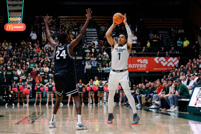 Feb 4, 2023; Fort Collins, Colorado, USA; Colorado State Rams guard John Tonje (1) looks to pass against Utah State Aggies forward Zee Hamoda (24) in the second half at Moby Arena. Mandatory Credit: Isaiah J. Downing-USA TODAY Sports