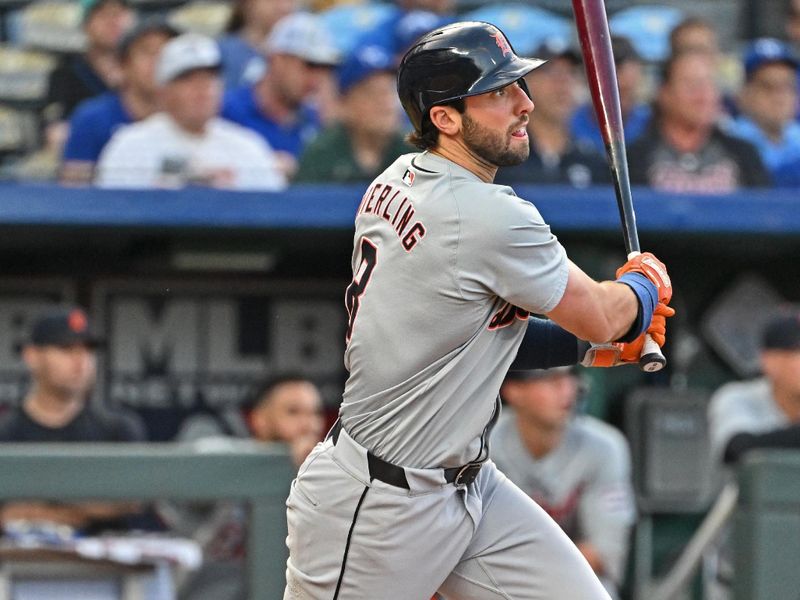 May 21, 2024; Kansas City, Missouri, USA;  Detroit Tigers third baseman Matt Vierling (8) hits a two RBI triple in the fourth inning against the Kansas City Royals at Kauffman Stadium. Mandatory Credit: Peter Aiken-USA TODAY Sports