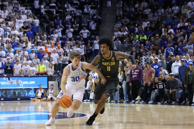 Feb 20, 2024; Provo, Utah, USA; Brigham Young Cougars guard Dallin Hall (30) dribbles past Baylor Bears forward Jalen Bridges (11) during the second half at Marriott Center. Mandatory Credit: Rob Gray-USA TODAY Sports