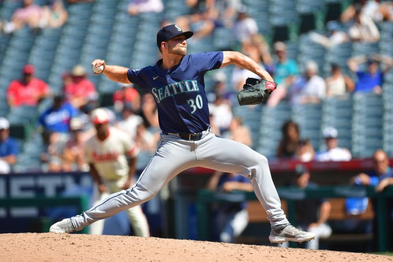 Jul 14, 2024; Anaheim, California, USA; Seattle Mariners pitcher Austin Voth (30) throws against the Los Angeles Angels during the eighth inning at Angel Stadium. Mandatory Credit: Gary A. Vasquez-USA TODAY Sports