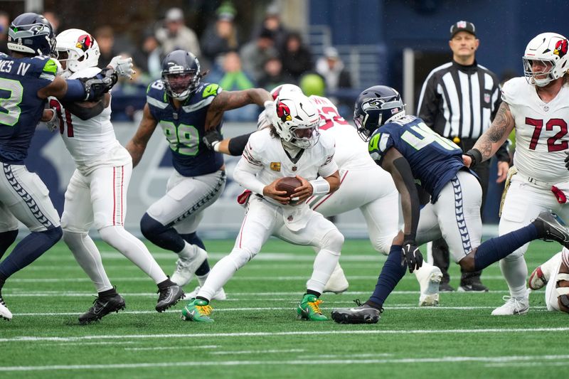 Arizona Cardinals quarterback Kyler Murray (1) scrambles during the first half of an NFL football game against against the Seattle Seahawks, Sunday, Nov. 24, 2024, in Seattle. (AP Photo/Stephen Brashear)