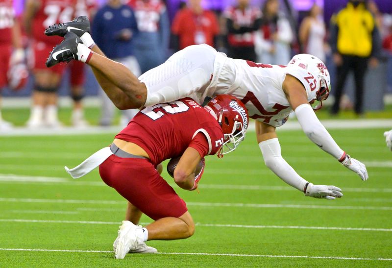 Dec 17, 2022; Inglewood, CA, USA; Fresno State Bulldogs wide receiver Zane Pope (2) is stopped by Washington State Cougars defensive back Jaden Hicks (25) after a pass reception in the second half of the LA Bowl at SoFi Stadium. Mandatory Credit: Jayne Kamin-Oncea-USA TODAY Sports