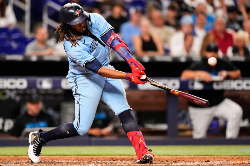 Jun 20, 2023; Miami, Florida, USA; Toronto Blue Jays first baseman Vladimir Guerrero Jr. (27) breaks hit bat  during the ninth inning against the Miami Marlins at loanDepot Park. Mandatory Credit: Rich Storry-USA TODAY Sports