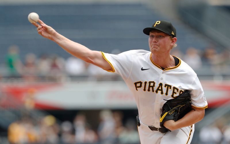 Jun 19, 2024; Pittsburgh, Pennsylvania, USA;  Pittsburgh Pirates starting pitcher Mitch Keller (23) delivers a pitch against the Cincinnati Reds during the first inning at PNC Park. Mandatory Credit: Charles LeClaire-USA TODAY Sports