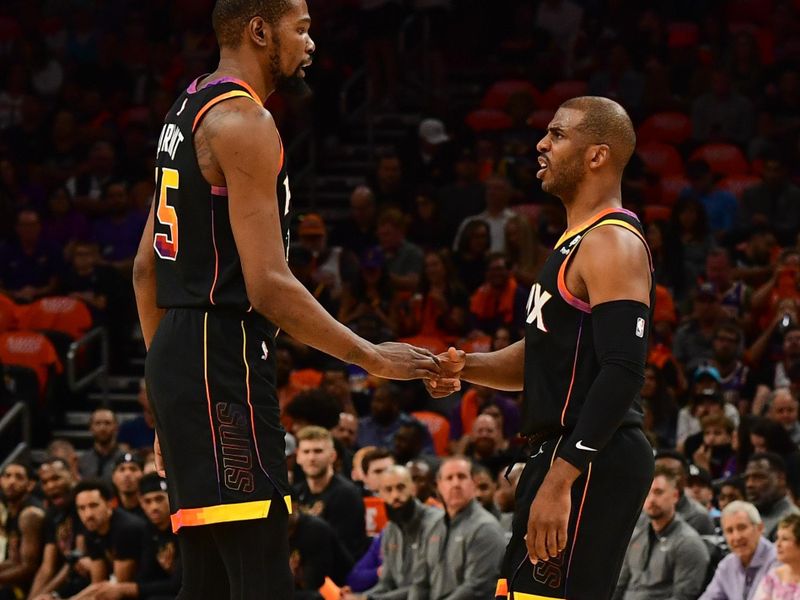 PHOENIX, AZ - APRIL 25:  Chris Paul #3 & Kevin Durant #35 of the Phoenix Suns high fives during the game during round one game five of the 2023 NBA Playoffs on on April 25, 2023 at Footprint Center in Phoenix, Arizona. NOTE TO USER: User expressly acknowledges and agrees that, by downloading and or using this photograph, user is consenting to the terms and conditions of the Getty Images License Agreement. Mandatory Copyright Notice: Copyright 2023 NBAE (Photo by Kate Frese/NBAE via Getty Images)