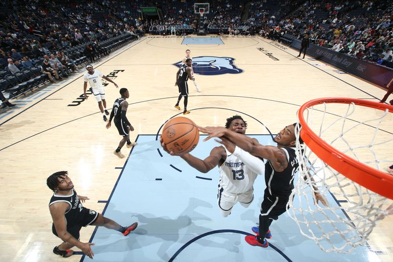 MEMPHIS, TN - February 26:  Jaren Jackson Jr. #13 of the Memphis Grizzlies drives to the basket during the game against the Brooklyn Nets on February 26, 2024 at FedExForum in Memphis, Tennessee. NOTE TO USER: User expressly acknowledges and agrees that, by downloading and or using this photograph, User is consenting to the terms and conditions of the Getty Images License Agreement. Mandatory Copyright Notice: Copyright 2024 NBAE (Photo by Joe Murphy/NBAE via Getty Images)