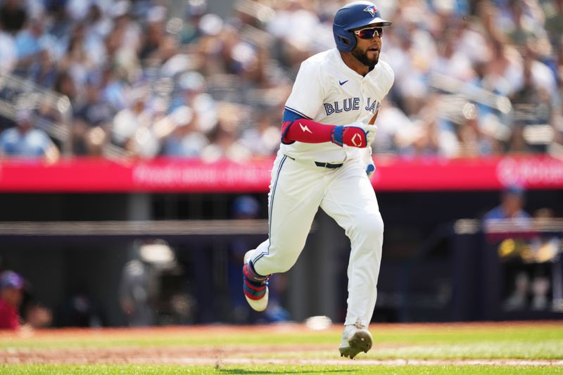 Jul 27, 2024; Toronto, Ontario, CAN; Toronto Blue Jays left fielder Steward Berroa (37) hits a double his first MLB hit against the Texas Rangers during the sixth inning at Rogers Centre. Mandatory Credit: Nick Turchiaro-USA TODAY Sports