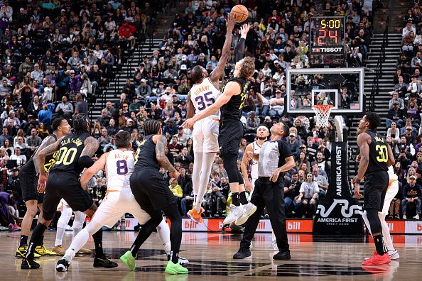 SALT LAKE CITY, UT - NOVEMBER 19: Kevin Durant #35 of the Phoenix Suns and Lauri Markkanen #23 of the Utah Jazz go up for the jump ball in overtime during the game on November 19, 2023 at Delta Center in Salt Lake City, Utah. NOTE TO USER: User expressly acknowledges and agrees that, by downloading and or using this Photograph, User is consenting to the terms and conditions of the Getty Images License Agreement. Mandatory Copyright Notice: Copyright 2023 NBAE (Photo by Melissa Majchrzak/NBAE via Getty Images)