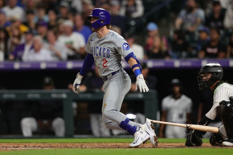 Sep 13, 2024; Denver, Colorado, USA; Chicago Cubs second baseman Nico Hoerner (2) hits a single in the fourth inning against the Colorado Rockies at Coors Field. Mandatory Credit: Isaiah J. Downing-Imagn Images