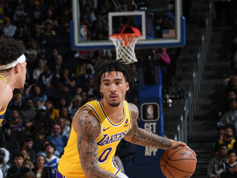 SAN FRANCISCO, CA - FEBRUARY 22:  Jalen Hood-Schifino #0 of the Los Angeles Lakers  goes to the basket during the game on February 22, 2024 at Chase Center in San Francisco, California. NOTE TO USER: User expressly acknowledges and agrees that, by downloading and or using this photograph, user is consenting to the terms and conditions of Getty Images License Agreement. Mandatory Copyright Notice: Copyright 2024 NBAE (Photo by Noah Graham/NBAE via Getty Images)