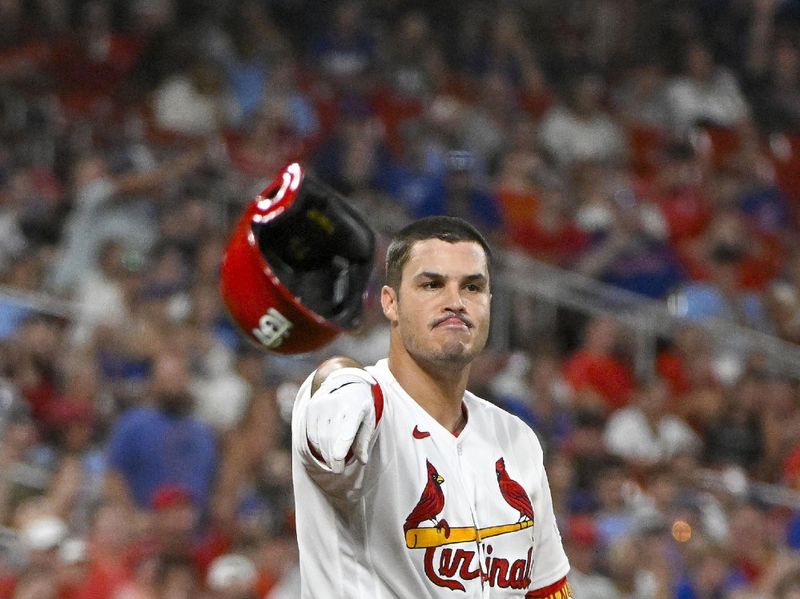 Jul 28, 2023; St. Louis, Missouri, USA;  St. Louis Cardinals third baseman Nolan Arenado (28) tosses his helmet after striking out against the Chicago Cubs during the eighth inning at Busch Stadium. Mandatory Credit: Jeff Curry-USA TODAY Sports