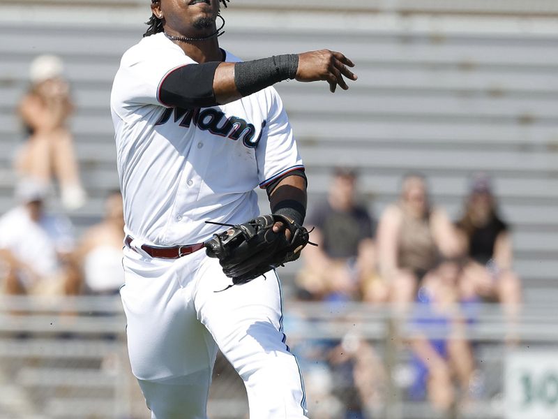 Feb 26, 2023; Jupiter, Florida, USA; Miami Marlins third baseman Jean Segura (9) throws to first against the St. Louis Cardinals in the third inning at Roger Dean Stadium. Mandatory Credit: Rhona Wise-USA TODAY Sports