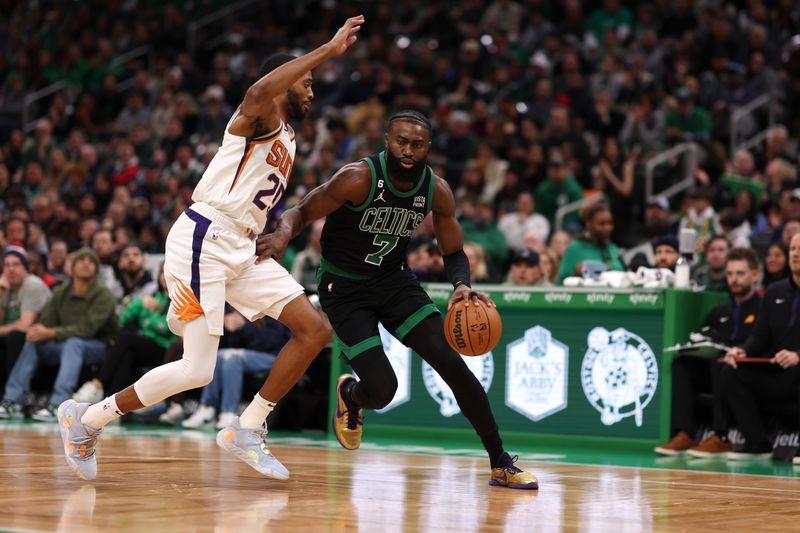 BOSTON, MASSACHUSETTS - FEBRUARY 03: Jaylen Brown #7 of the Boston Celtics dribbles against Mikal Bridges #25 of the Phoenix Suns at TD Garden on February 03, 2023 in Boston, Massachusetts. NOTE TO USER: User expressly acknowledges and agrees that, by downloading and or using this photograph, User is consenting to the terms and conditions of the Getty Images License Agreement. (Photo by Maddie Meyer/Getty Images)