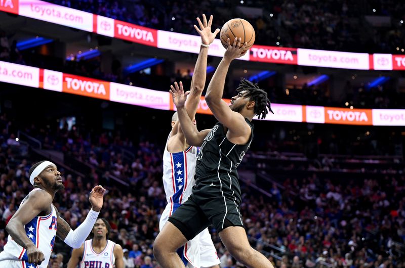 PHILADELPHIA, PENNSYLVANIA - APRIL 14: Cam Thomas #24 of the Brooklyn Nets drives to the basket in the fourth quarter against \p40 at the Wells Fargo Center on April 14, 2024 in Philadelphia, Pennsylvania.  NOTE TO USER: User expressly acknowledges and agrees that, by downloading and or using this photograph, User is consenting to the terms and conditions of the Getty Images License Agreement. (Photo by Greg Fiume/Getty Images)