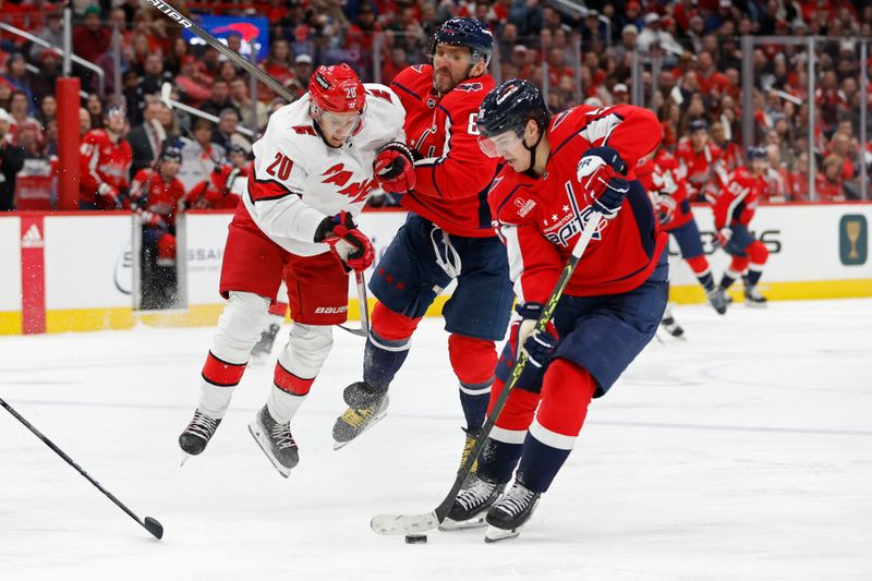 Jan 5, 2024; Washington, District of Columbia, USA; Washington Capitals left wing Alex Ovechkin (8) checks Carolina Hurricanes center Sebastian Aho (20) as Capitals right wing Nicolas Aube-Kubel (96) controls the puck in the third period at Capital One Arena. Mandatory Credit: Geoff Burke-USA TODAY Sports