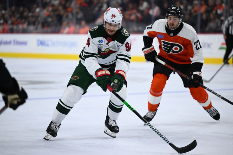 Oct 26, 2024; Philadelphia, Pennsylvania, USA; Minnesota Wild center Jakub Lauko (94) reaches for the puck against the Philadelphia Flyers in the second period at Wells Fargo Center. Mandatory Credit: Kyle Ross-Imagn Images