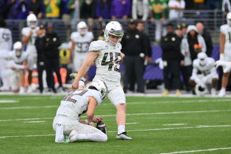 Oct 14, 2023; Seattle, Washington, USA; Oregon Ducks place kicker Camden Lewis (49) attempts a field goal at the end of the fourth quarter against the Washington Huskies at Alaska Airlines Field at Husky Stadium. Mandatory Credit: Steven Bisig-USA TODAY Sports